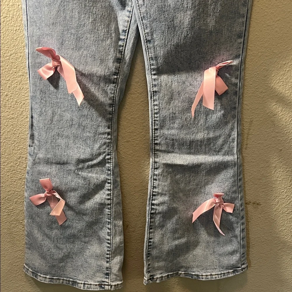 SHEIN Light Blue Jeans with Pink Bow Accents